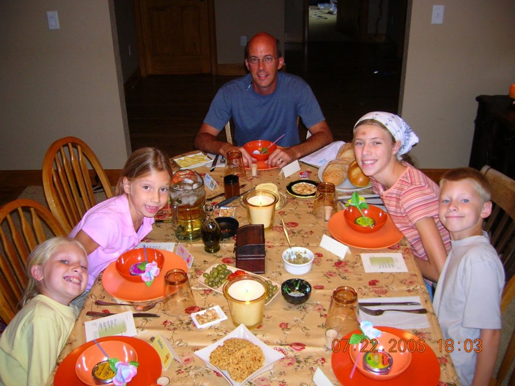 Author Demonstrates Benefits of Family Meals at Table