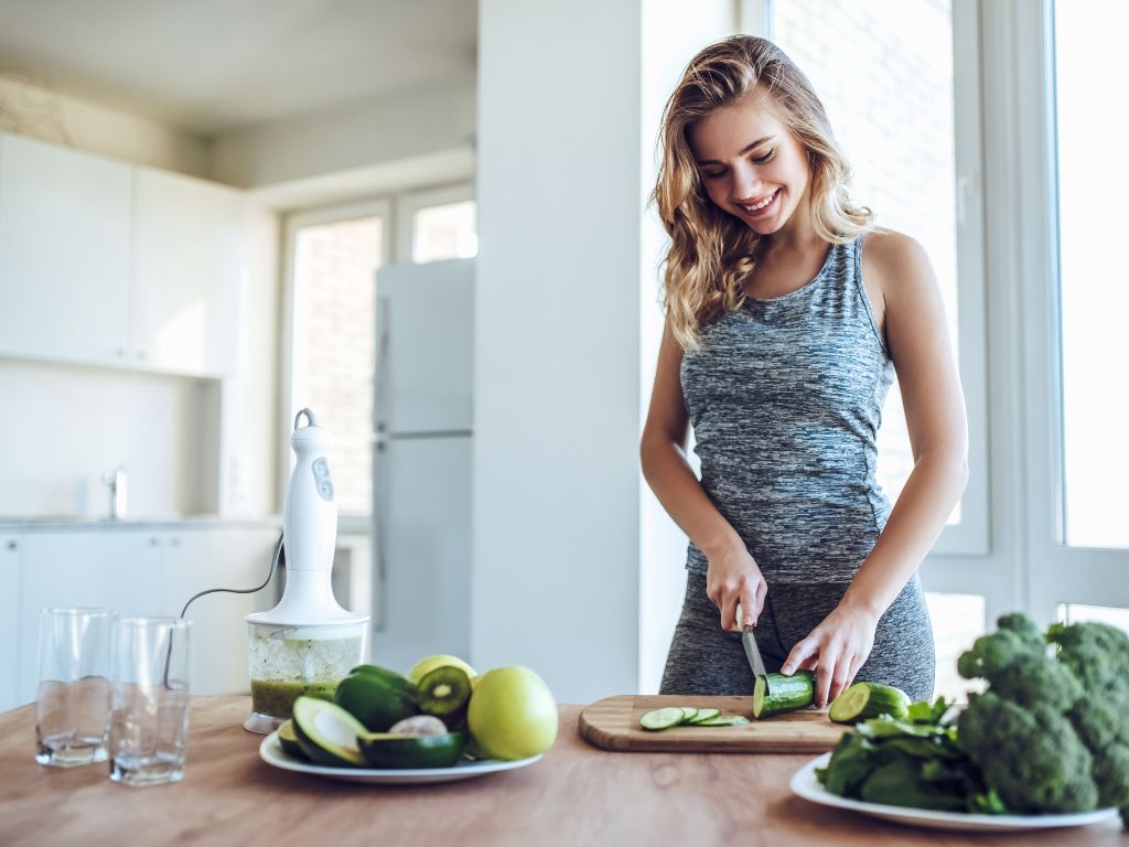 woman preparing healthy greens