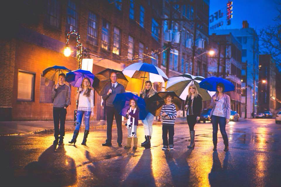 family photo with umbrellas