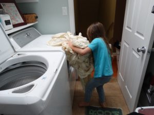 Children doing laundry