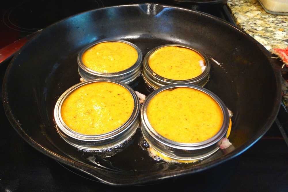 Canning jar rings with batter to make Trader Joe's Copy Cat Scallion Pancakes 