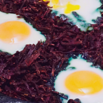 Skillet Baked Eggs Nested in Hashed Purple Sweet Potatoes