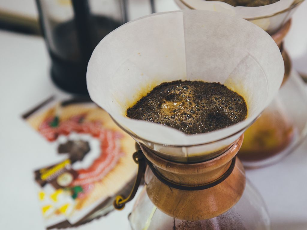 coffee grounds in paper on chemex coffee brewer